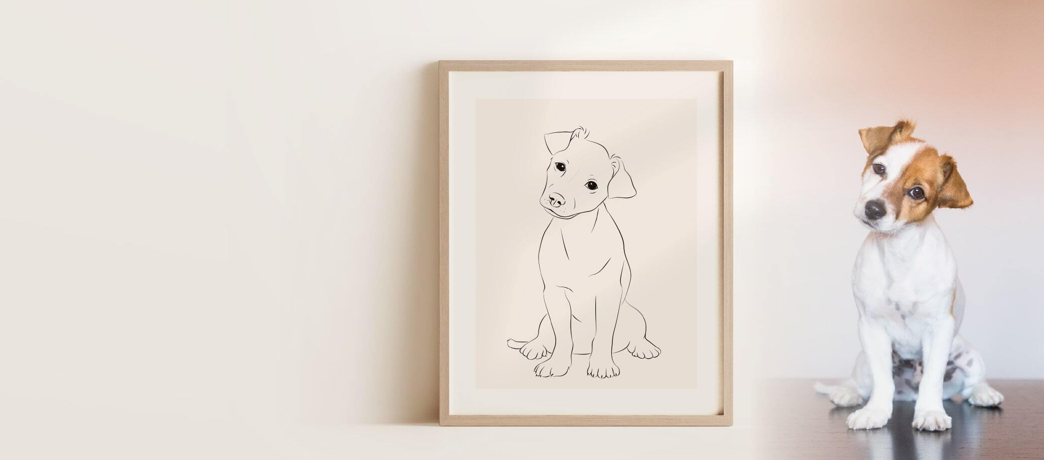Un dessin Miroar Line Art dans un cadre en chêne d'un jeune Jack Russel qui se trouve à côté du dessin